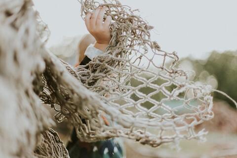 hand with fishing net