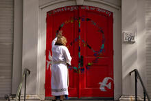 church door with peace symbol